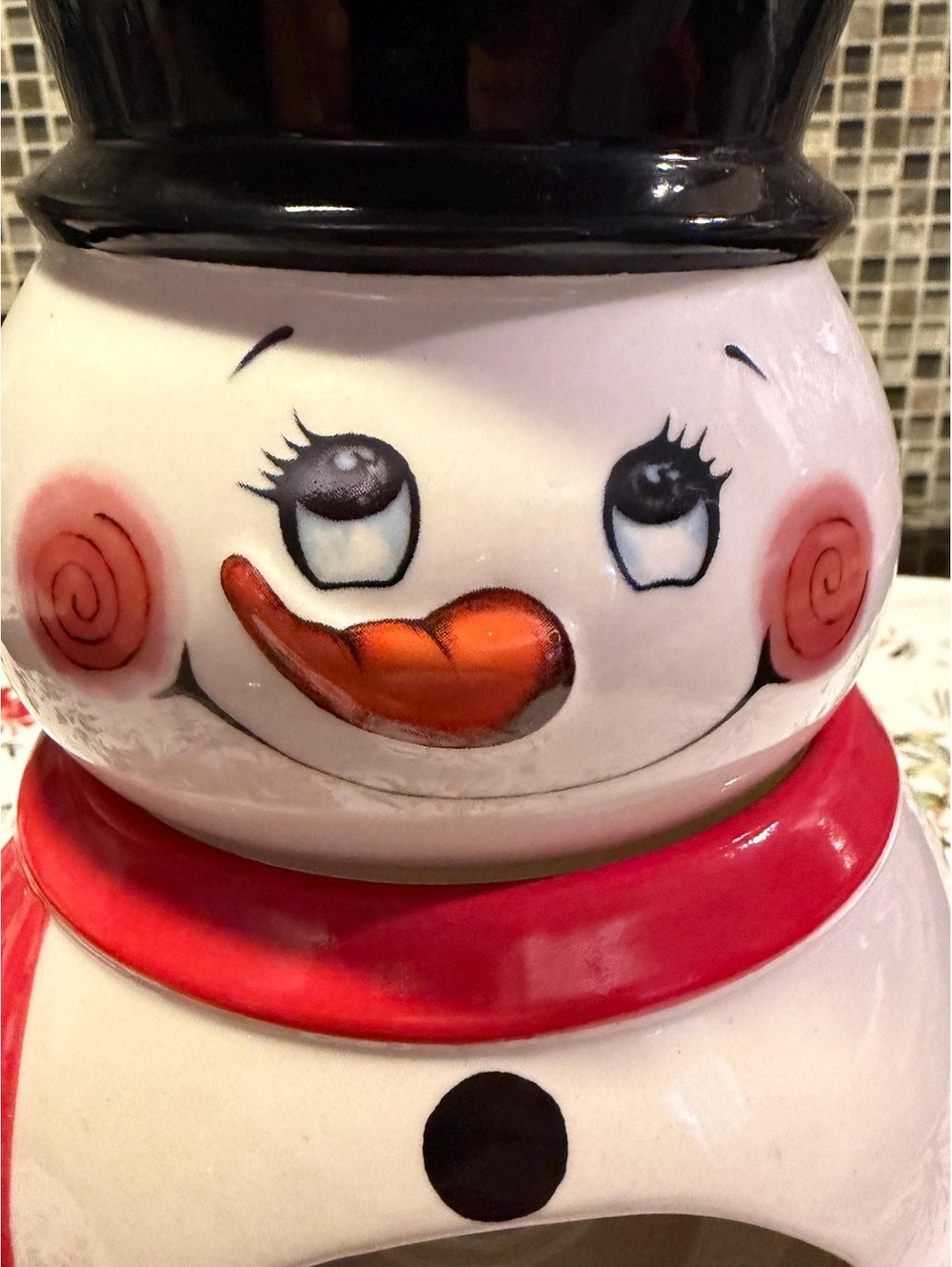 This is a ceramic snowman-shaped holiday fondue pot or candle warmer.